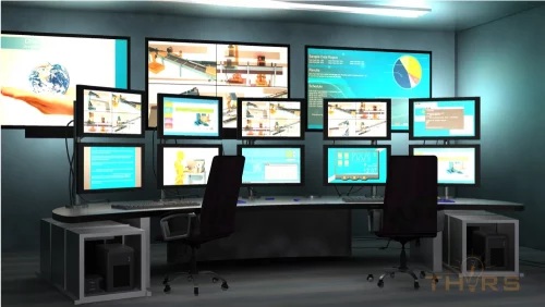 Several computer monitors displaying human machine interfaces used to operate and monitor automated processes and machinery