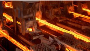 Steel shapes being produced in a smelting foundry.
