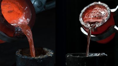 Two crucibles pouring molten aluminum into molds