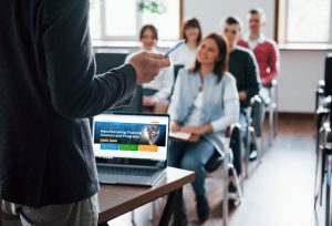 A training program taking place in a classroom where they are talking about THORS.