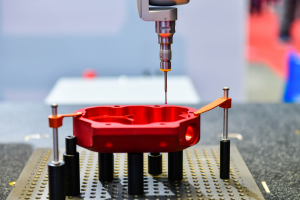 A Close-Up Shot of a CMM Probe Using Coordinate Metrology to Measure a Workpiece