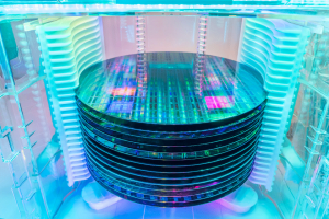 A stack of silicon wafers, containing microchips made of different semiconductor materials.