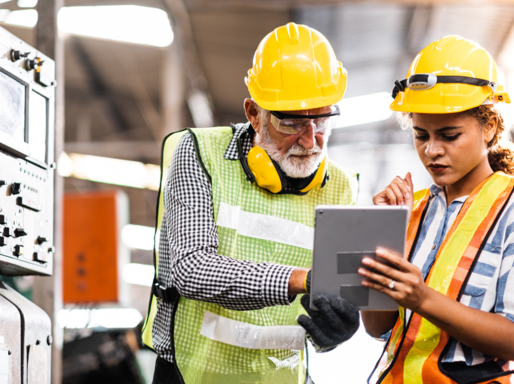 An experienced worker teaching a new worker.