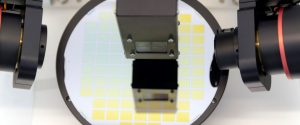 A semiconductor metrology instrument inspecting a wafer.