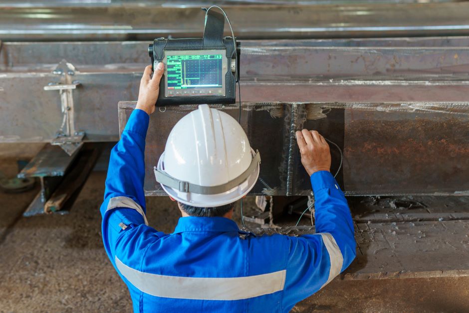 Armed with an understanding of welding symbols and the correct interpretation of drawings, an inspector uses testing equipment to ensure accuracy and compliance of a successful welding project.