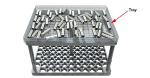 An example of racking and stacking showing random loading of metal parts in a tray ready for the heat treatment process. 