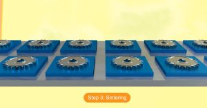 Illustration showing metal sprockets arranged on blue trays during the sintering process step of manufacturing sprockets using the powder metallurgy process.