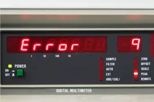 A close-up image of a digital multimeter showing “Error,” representing electrical measurement errors.