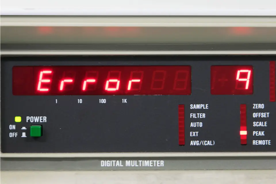 A close-up image of a digital multimeter showing “Error,” representing electrical measurement errors.