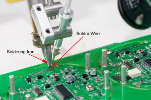The robotic soldering method, where robotic arms hold soldering iron and solder wire.